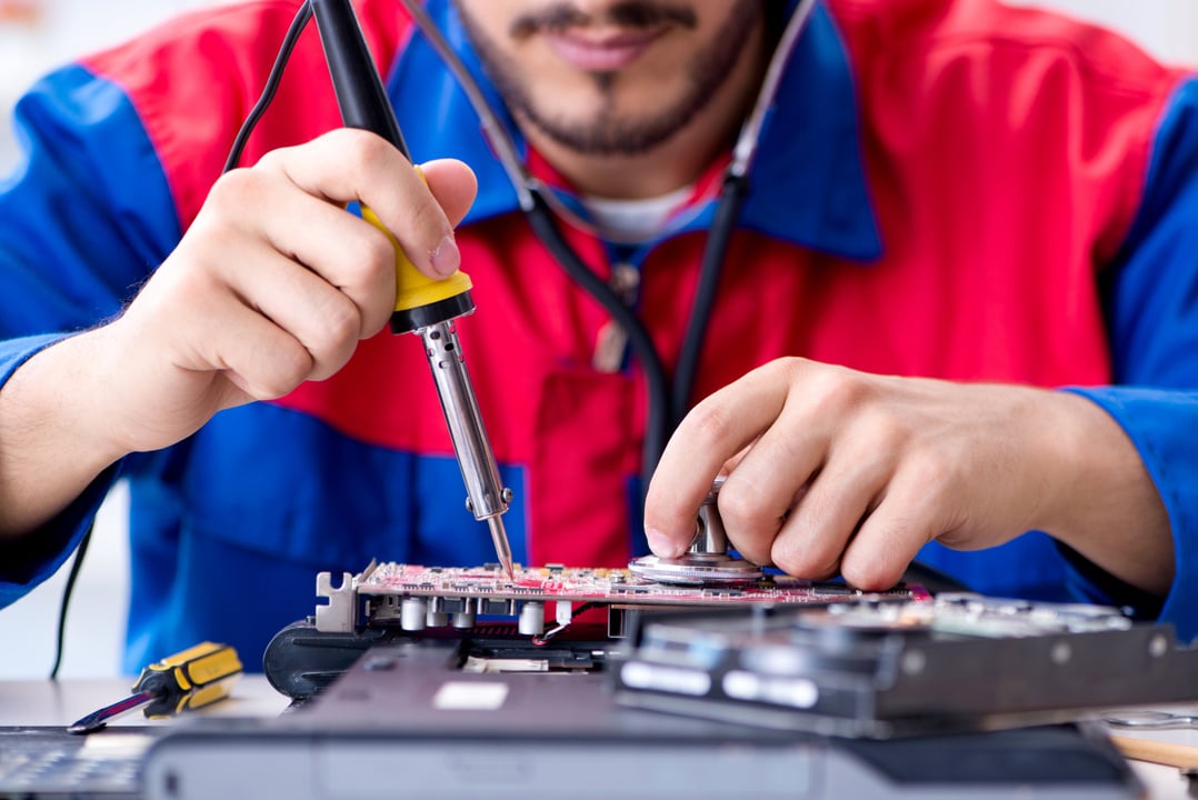 Technician Fixing Computer Laptop