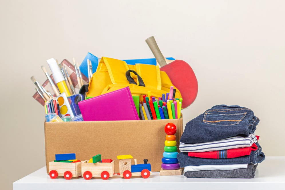 Donation Box with Clothes, Books, School Supplies and Toys for Charity