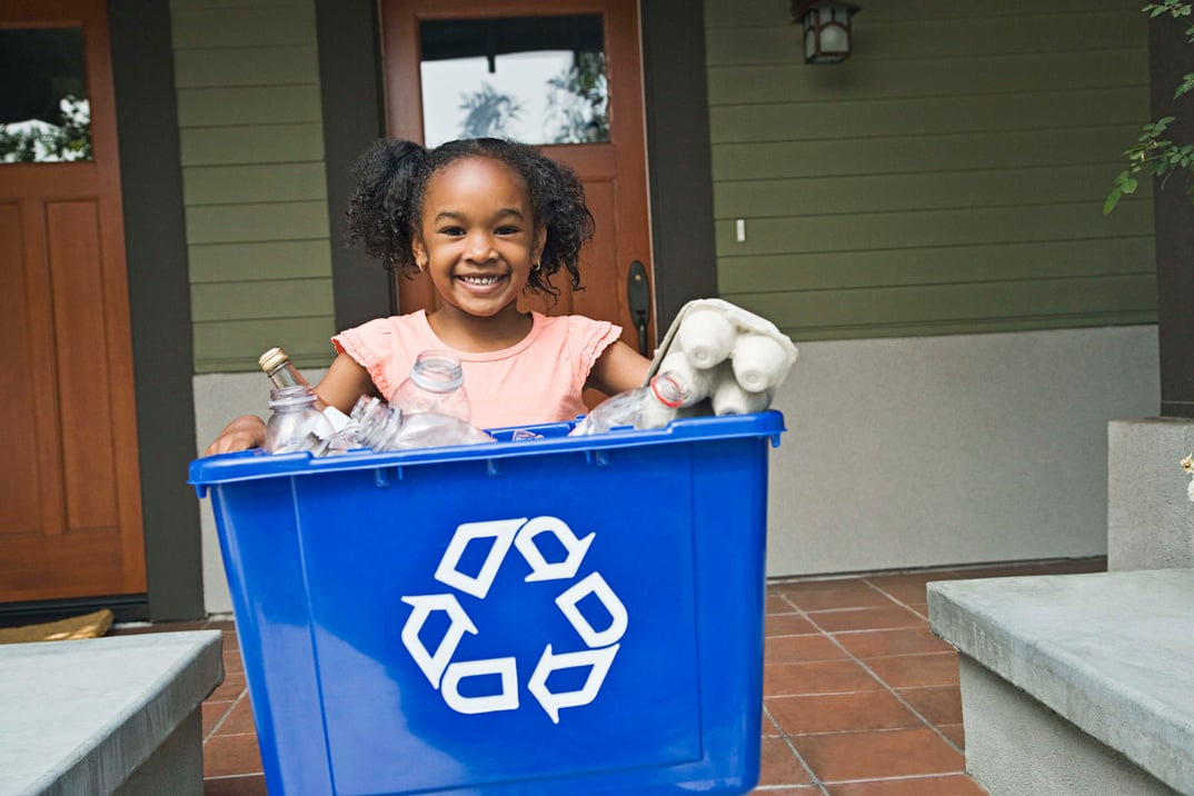 Girl with recycling bin